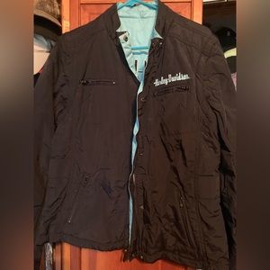 Harley Davidson Motorcycles reversible jacket with removable sleeves.